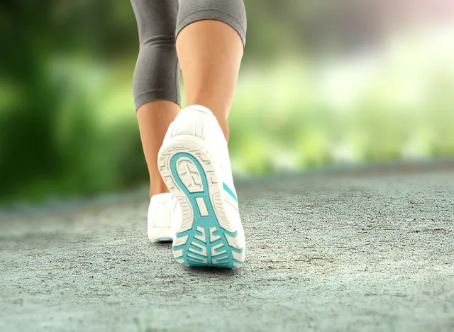 close-up of sneakers, walking woman, idea of ​​how many steps per day to lose weight